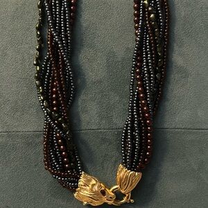 Beautiful necklace by Joan Rivers lion heads.  black, green copper, gray …